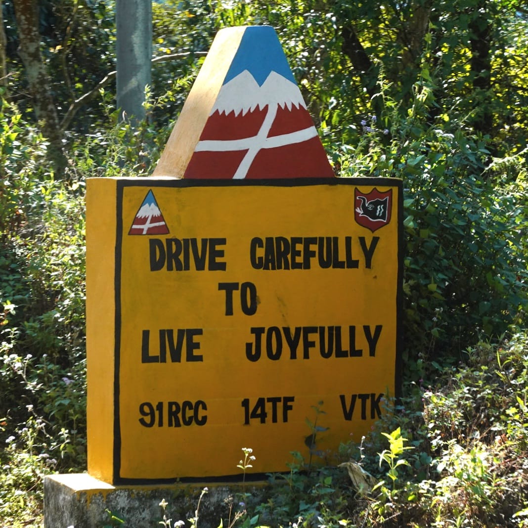 Border Roads Organisation sign reading Drive Carefully To Live Joyfully in the Arunachal hills