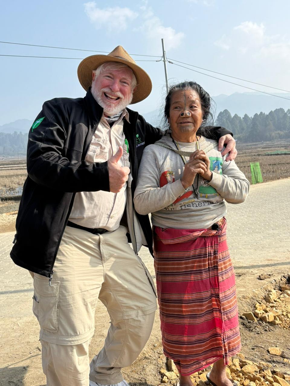 George Lowe with an Apatani elder beside the paddy fields of Ziro Valley during his Arunachal Pradesh expedition